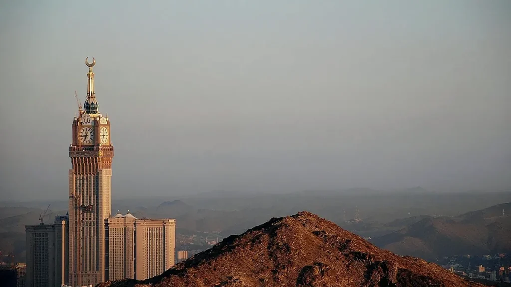 Makkah skyline and surrounding hills for a hotel move and ziyarat plan